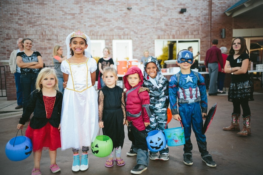 Young kids in Halloween costumes. 
