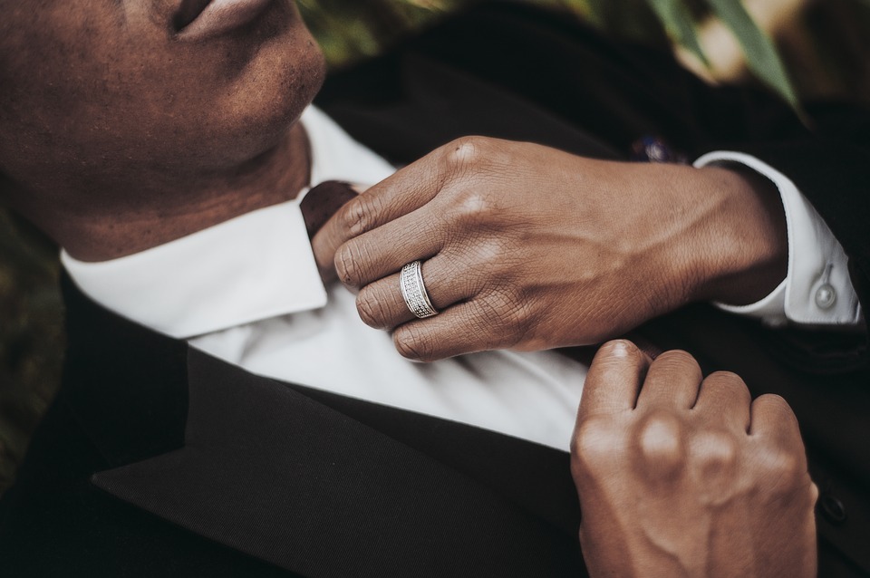 A man wearing a tux for a New Year's Eve event. 