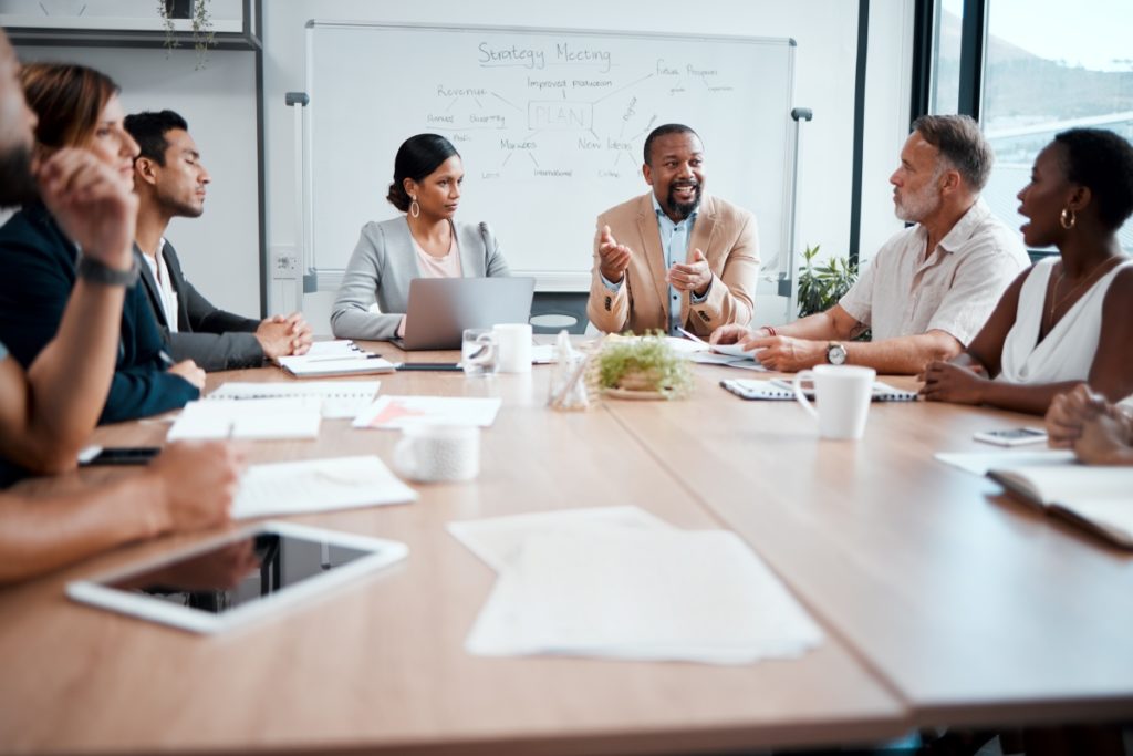 sitting around a table having a meeting